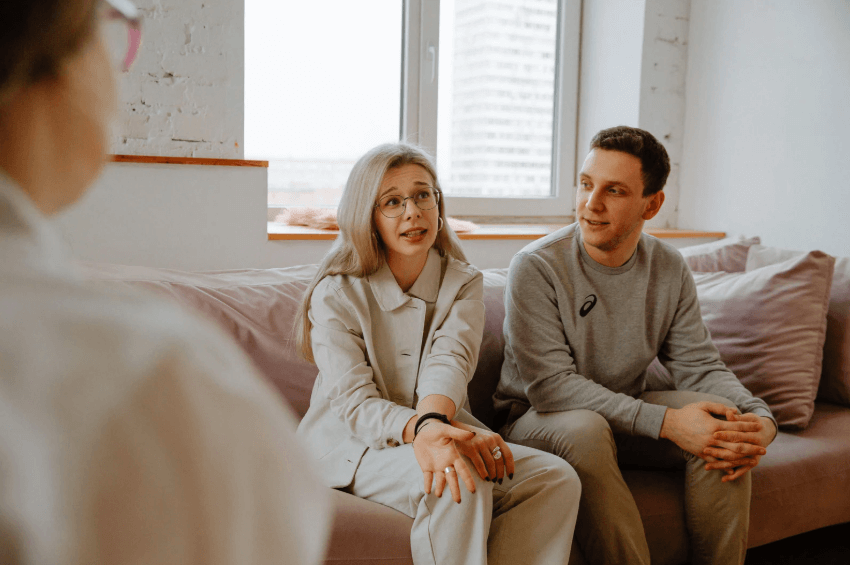 Couple talking with a therapist.